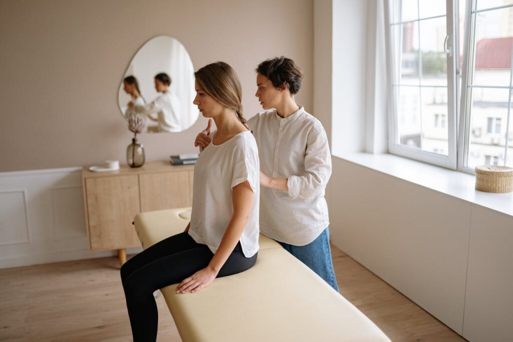 A Massage Therapist Massaging a Client